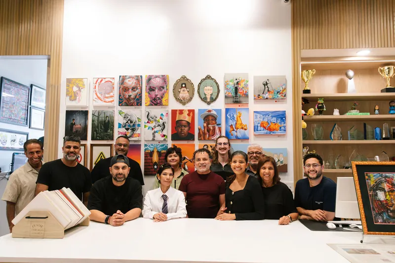 The Frame Chicago, Chicago Award Source and Engrave Live team at the shop counter.